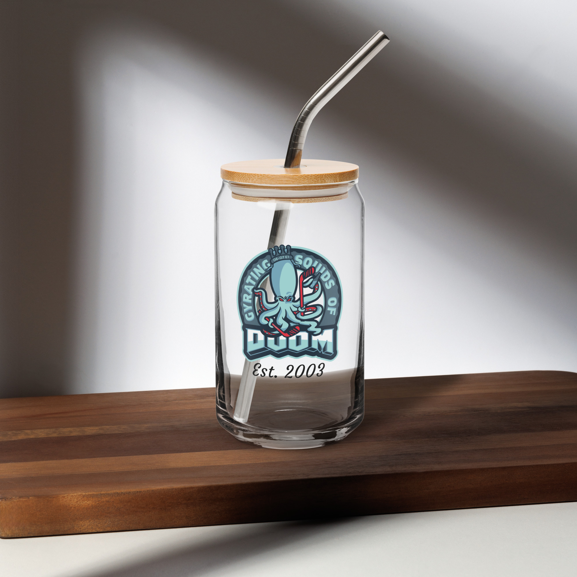 ide view of Gyrating Squids of Doom 16 oz glass with team logo and clear beer can shape with lid and straw
